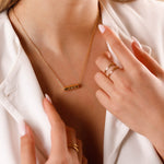 collier en plaqué or avec amulette pour femme 